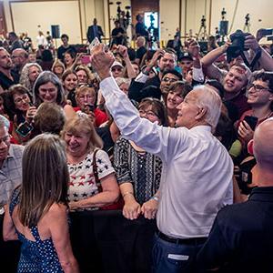 Vice President Joe Biden takes a selfie with students and fans
