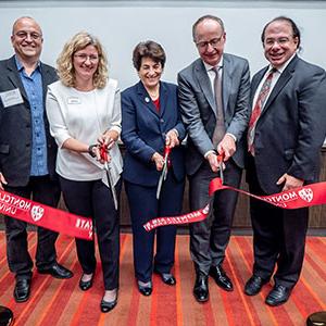 Alumnus Anthony Scriffignano ’82, ’85 MA and University board member Francis Cuss join Susan A. Cole, Lora Billings and Constantine Coutras at the opening
