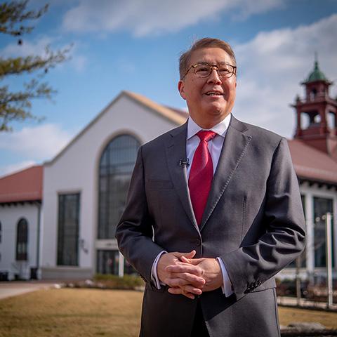 Photo of Montclair State University Provost Junius J. Gonzales in front of Cole Hall