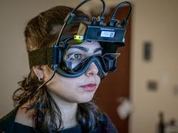 Audiology student Natalie Niyazov wears virtual reality goggles to test her balance using a cutting-edge system acquired by Montclair.