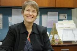 photo of professor Elizabeth Emery smiling in her office