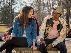 Two Montclair State University students laughing