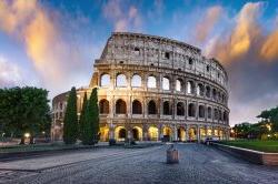Photo of the Colosseum in Rome at sunset.