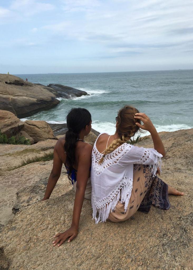 Students on rocky shore in Brazil